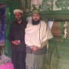 Mian Baghdad Sahib Great Grandson of Khawaja Nizamudin Auliya RA with Sahibzada Faisal Badshah Zahidi Standing at the doorstep of the Mazar Paak 1